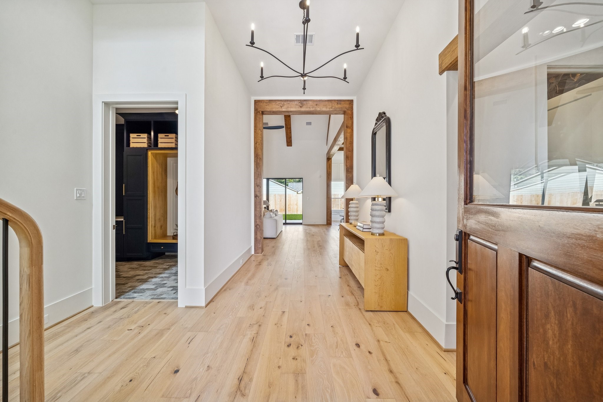 511 Graceland Street Houston, TX 77009 - Photo 4 of 45 The front door is 9 ft tall and opens to a wide foyer with an elegant chandelier. The mudroom and garage doors are on the left.