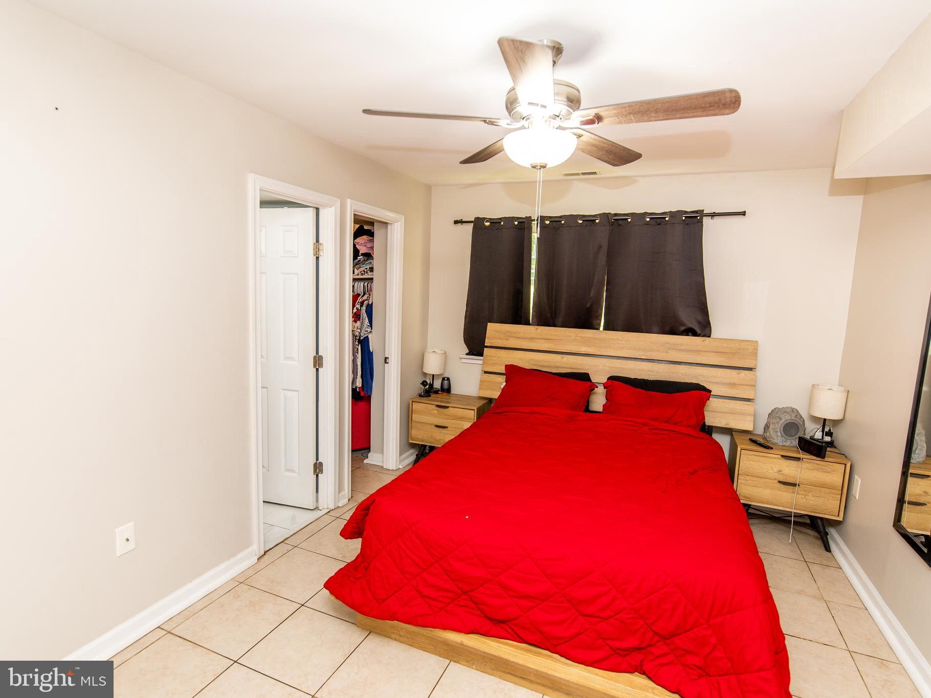 3934 Bel Pre Road, Unit 39342 Silver Spring, MD 20906 - Photo 16 of 30 a bed room with a bed and a window