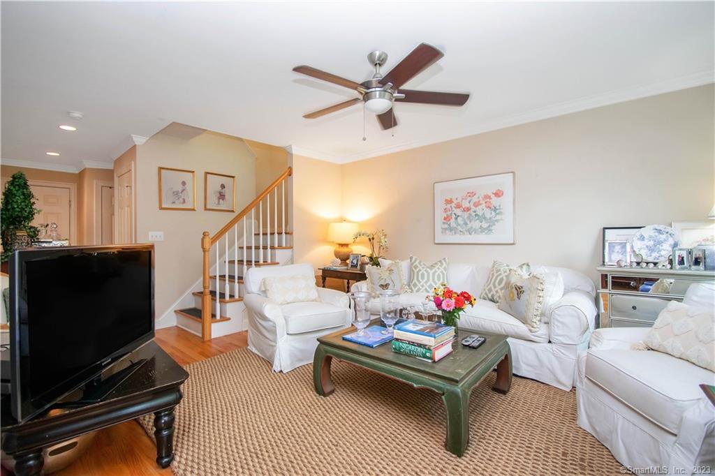 469 South Benson Road Fairfield, CT 06824 - Photo 11 of 20 a living room with furniture and a flat screen tv