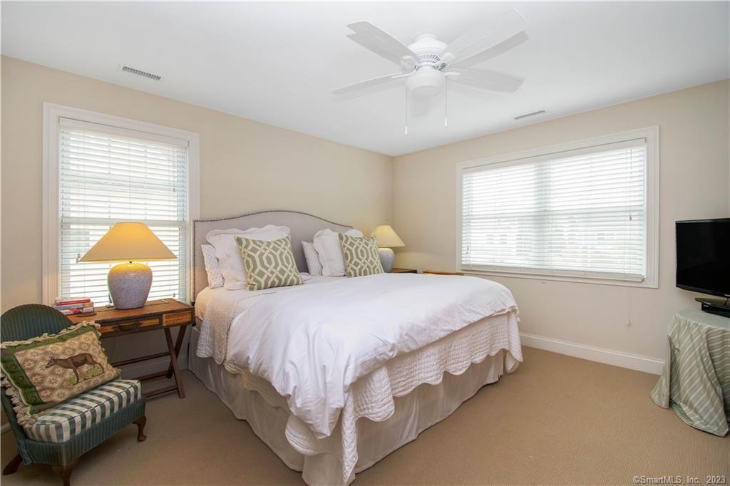 469 South Benson Road Fairfield, CT 06824 - Photo 13 of 20 a bedroom with a bed couch and window