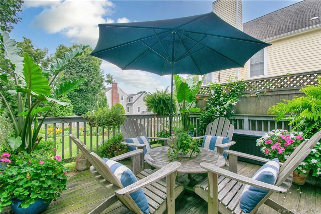 469 South Benson Road Fairfield, CT 06824 - Photo 15 of 20 a view of an outdoor sitting area with furniture and umbrella