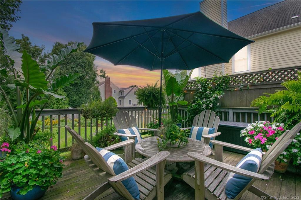 469 South Benson Road Fairfield, CT 06824 - Photo 16 of 20 a patio with a patio table and chairs