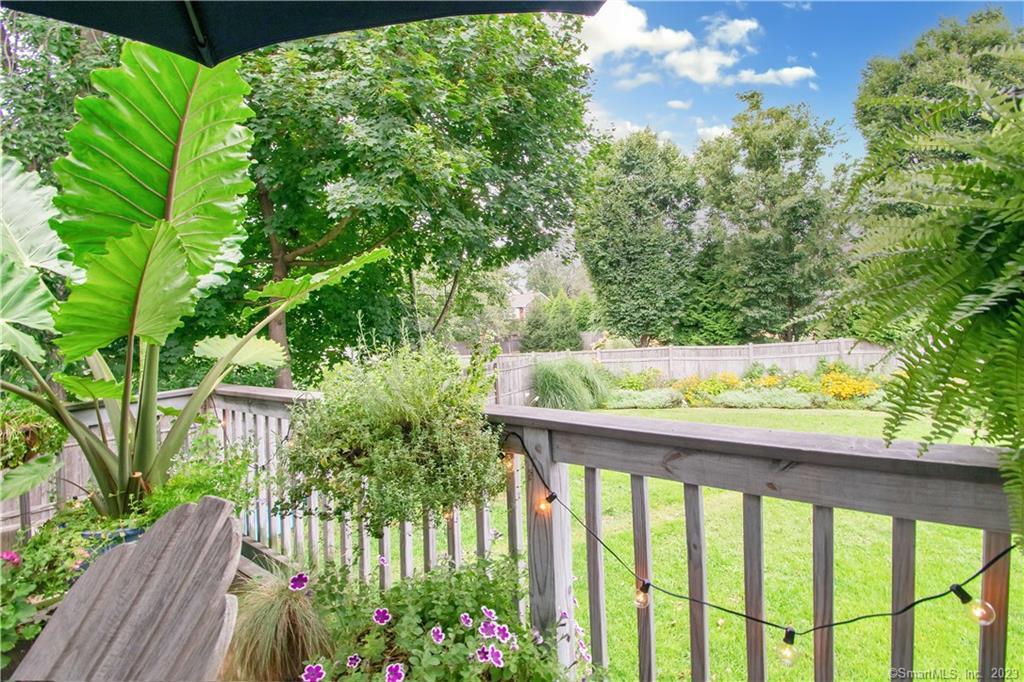 469 South Benson Road Fairfield, CT 06824 - Photo 17 of 20 a wooden fence with trees in the background