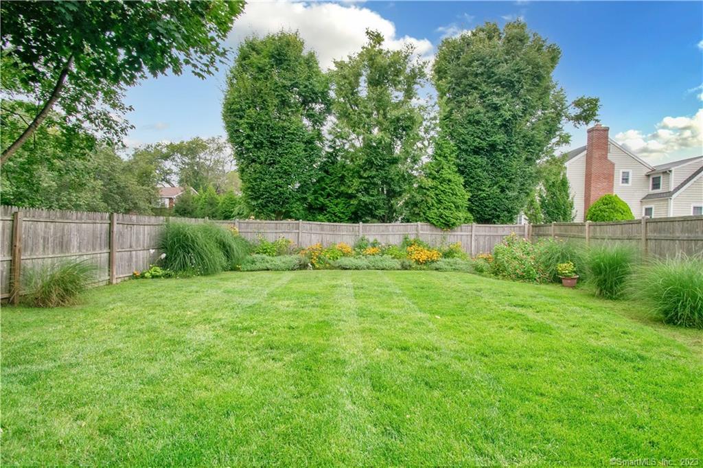 469 South Benson Road Fairfield, CT 06824 - Photo 19 of 20 a view of garden with houses in the background