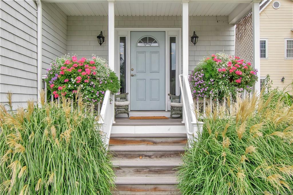 469 South Benson Road Fairfield, CT 06824 - Photo 2 of 20 a front view of a house with a garden
