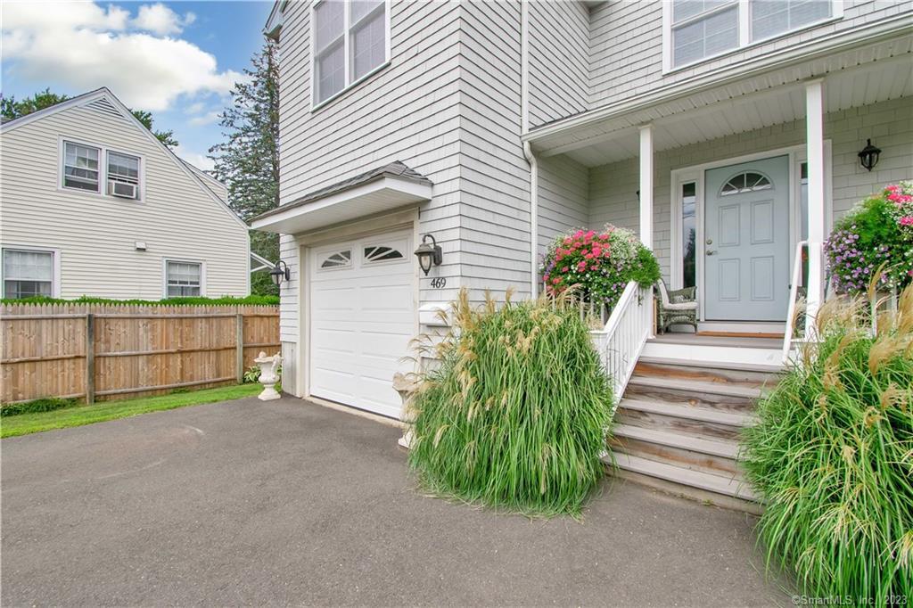 469 South Benson Road Fairfield, CT 06824 - Photo 5 of 20 a front view of a house with a garden