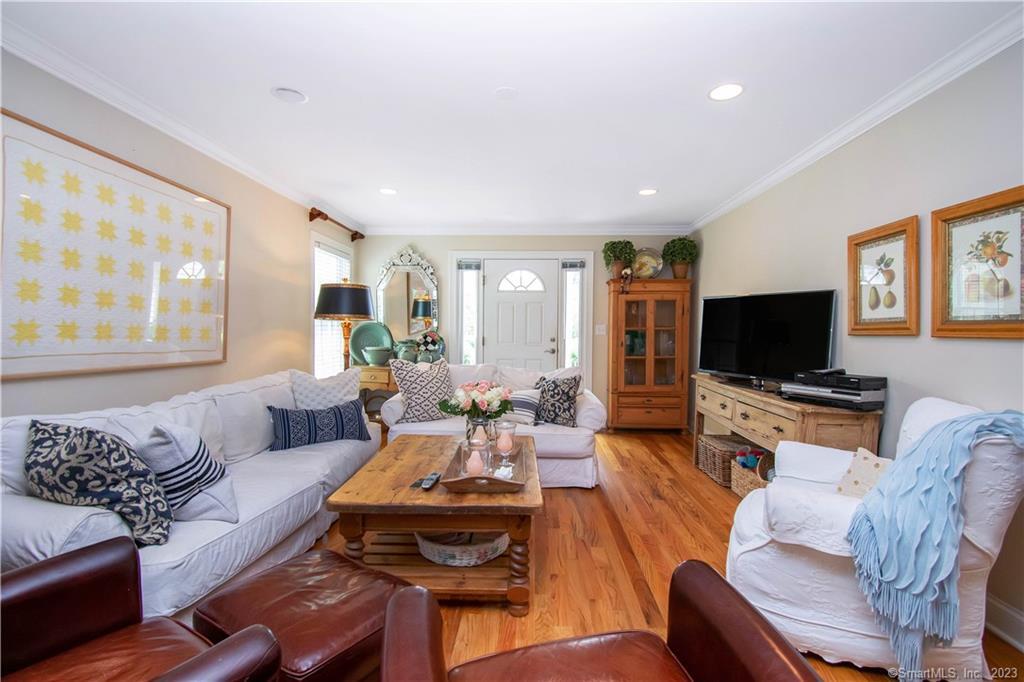 469 South Benson Road Fairfield, CT 06824 - Photo 6 of 20 a living room with furniture and a flat screen tv