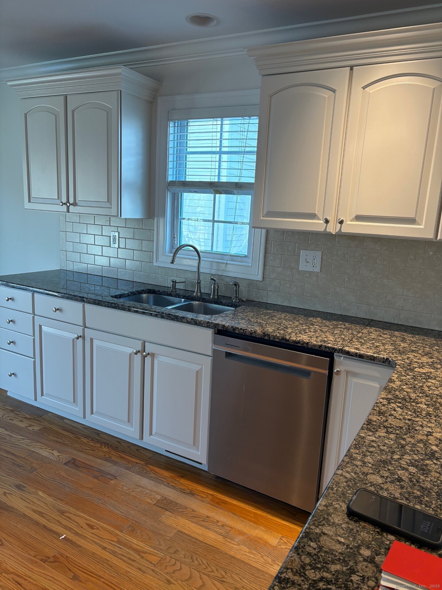 469 South Benson Road Fairfield, CT 06824 - Photo 9 of 20 a kitchen with granite countertop white cabinets and sink