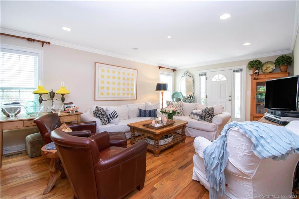 469 South Benson Road Fairfield, CT 06824 - Photo 10 of 20 a living room with furniture a flat screen tv and a window