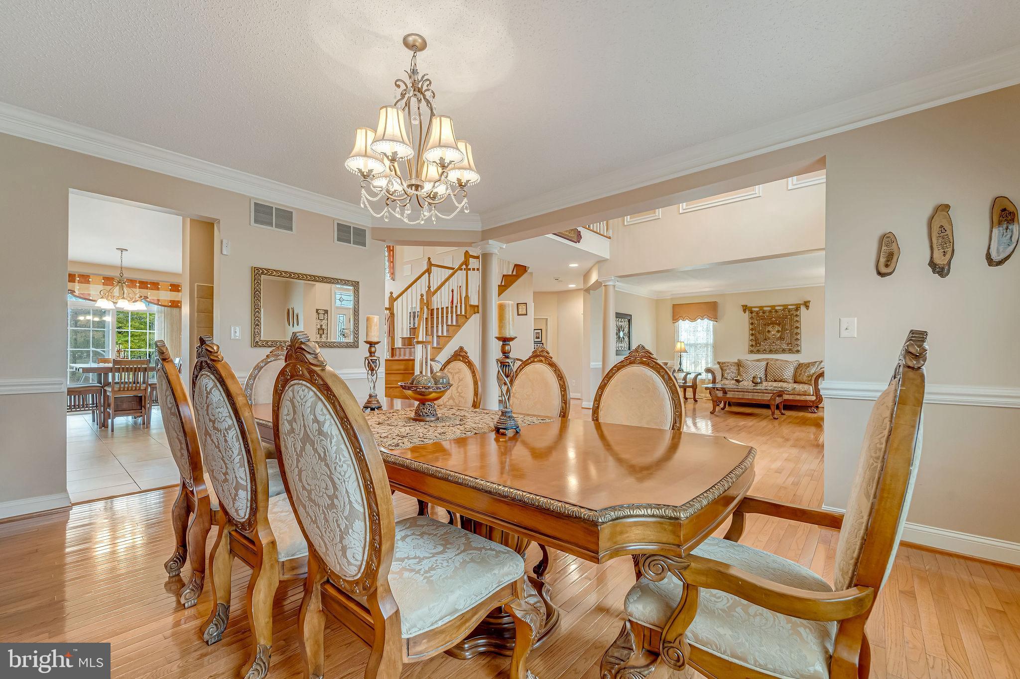 2 Lansbrook Court Sewell, NJ 08080 - Photo 15 of 44 a view of a dining room with furniture wooden floor and chandelier