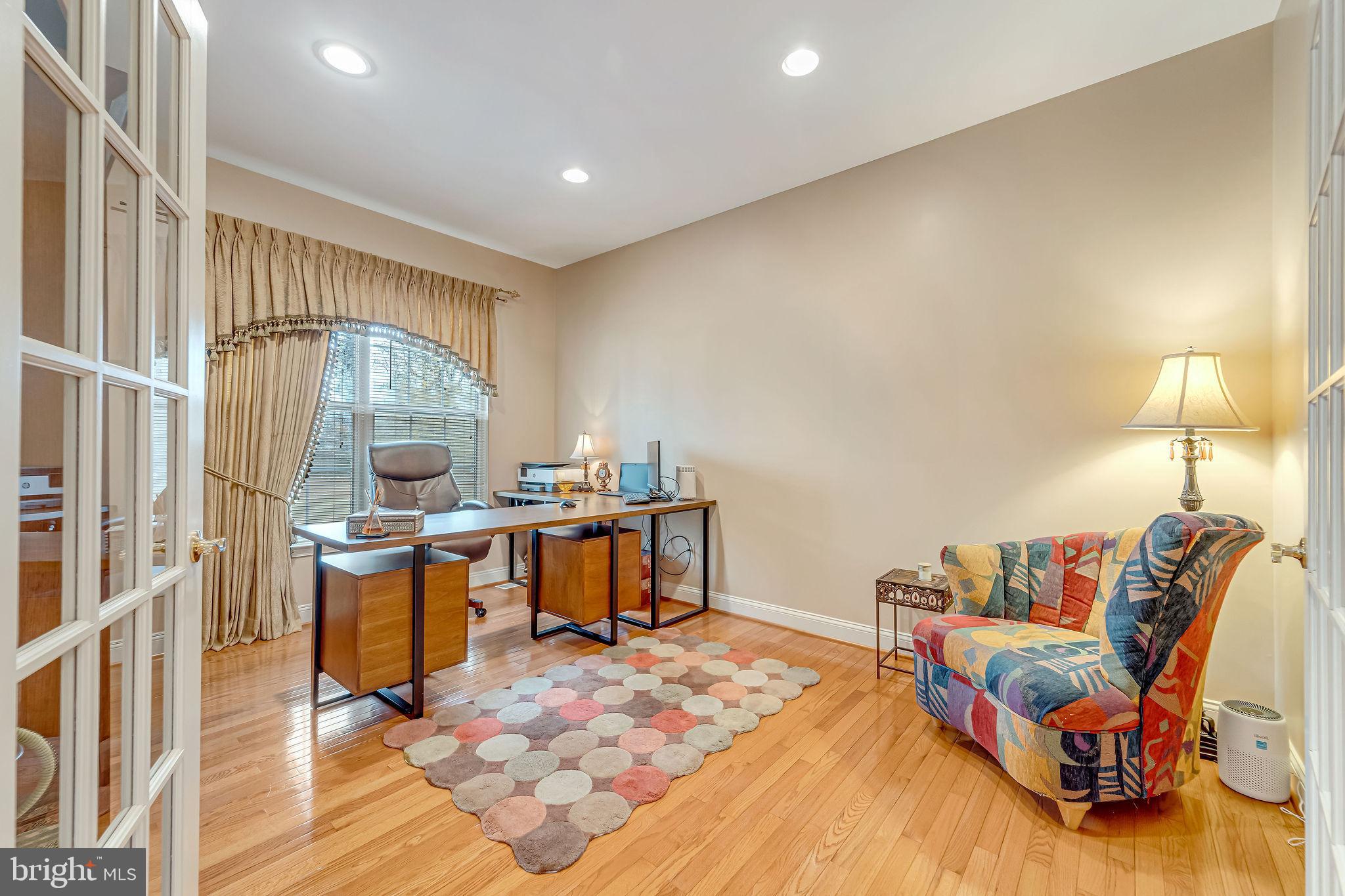 2 Lansbrook Court Sewell, NJ 08080 - Photo 16 of 44 a living room with furniture a rug and a table