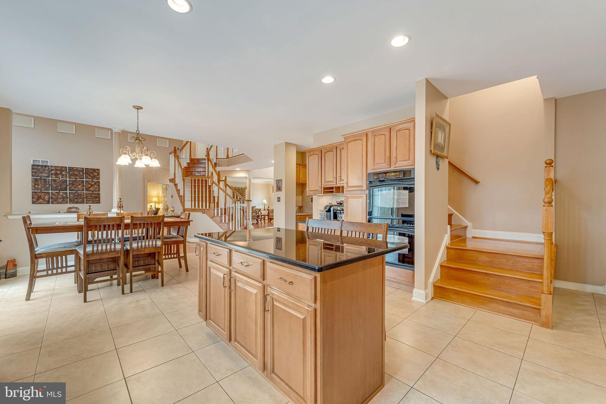 2 Lansbrook Court Sewell, NJ 08080 - Photo 24 of 44 a kitchen with stainless steel appliances kitchen island granite countertop a refrigerator and a sink