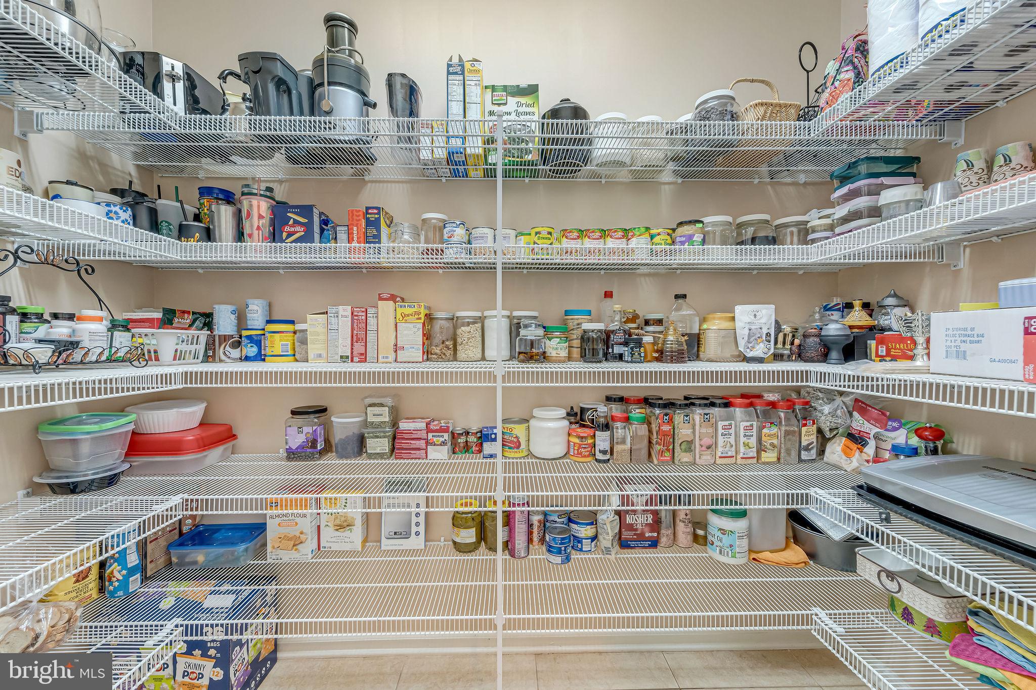 2 Lansbrook Court Sewell, NJ 08080 - Photo 26 of 44 a cabinet with lots of different kinds of food on it