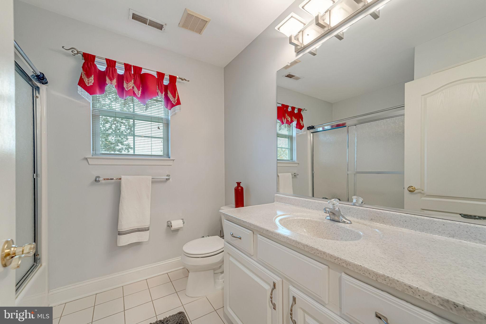 2 Lansbrook Court Sewell, NJ 08080 - Photo 29 of 44 a bathroom with a sink vanity mirror and toilet