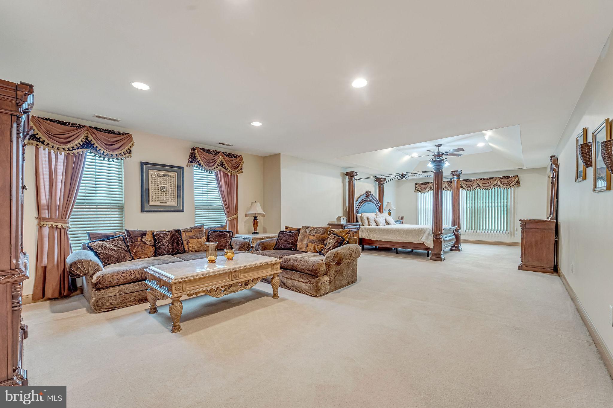 2 Lansbrook Court Sewell, NJ 08080 - Photo 34 of 44 a living room with furniture and a chandelier