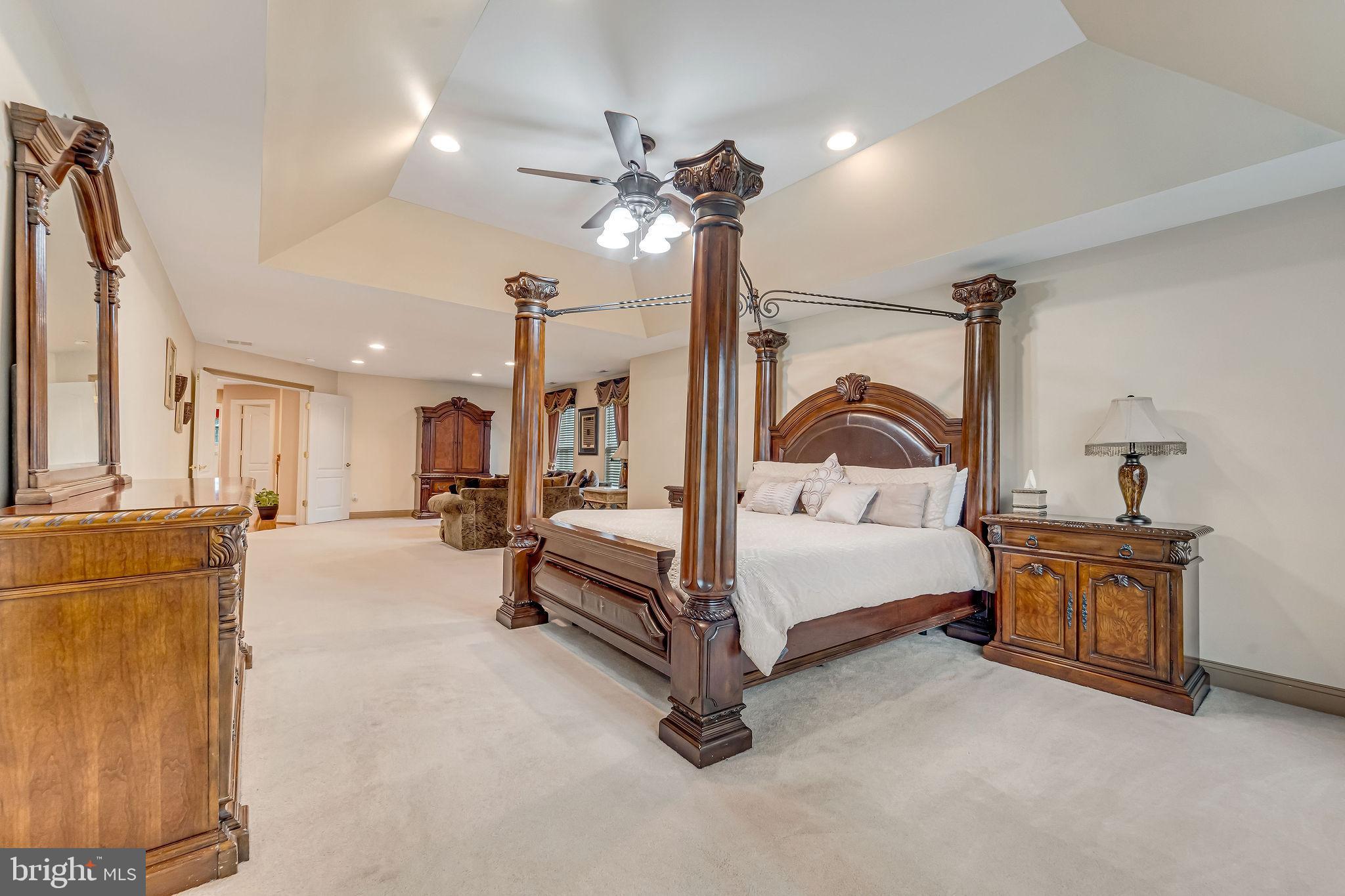 2 Lansbrook Court Sewell, NJ 08080 - Photo 35 of 44 a bedroom with furniture and a chandelier