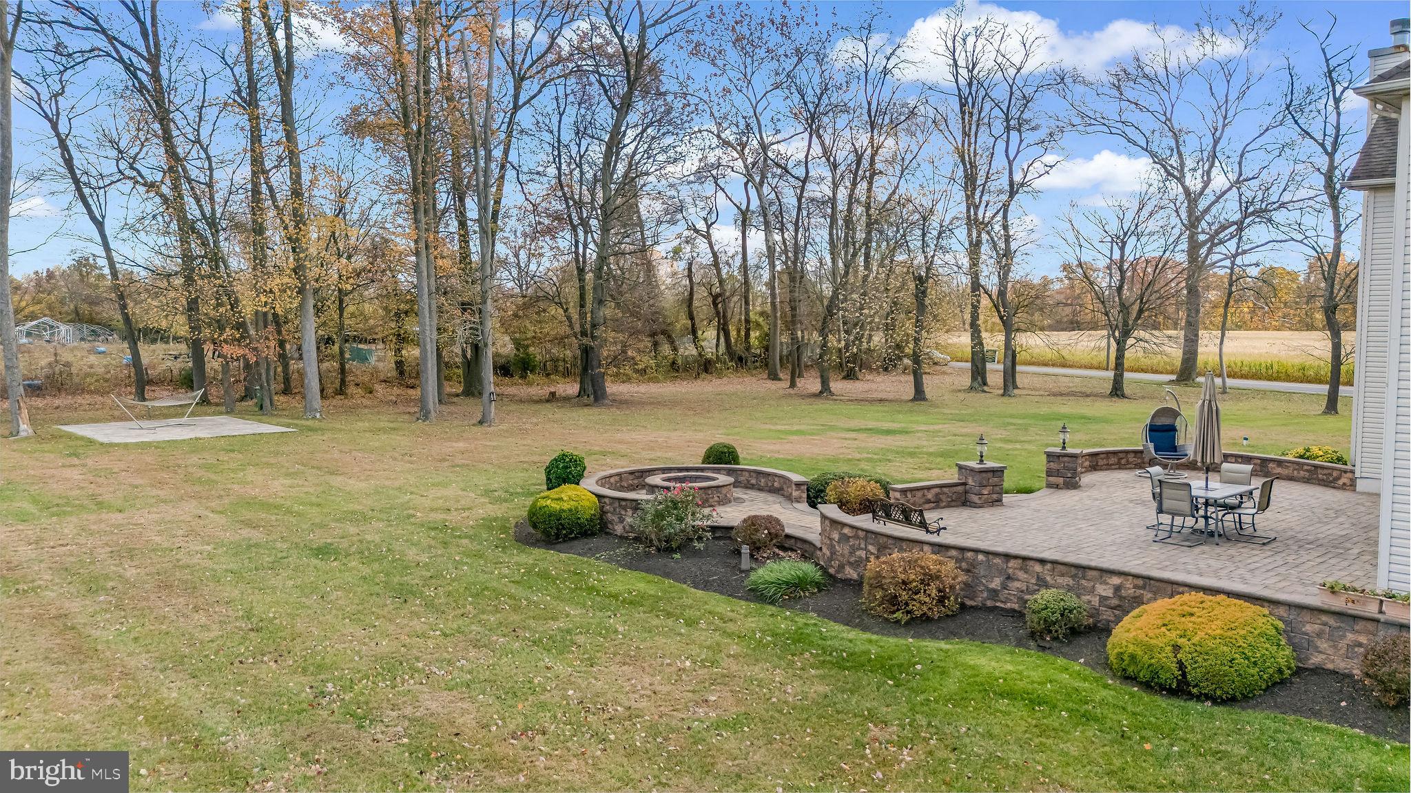 2 Lansbrook Court Sewell, NJ 08080 - Photo 7 of 44 a backyard of a house with table and chairs