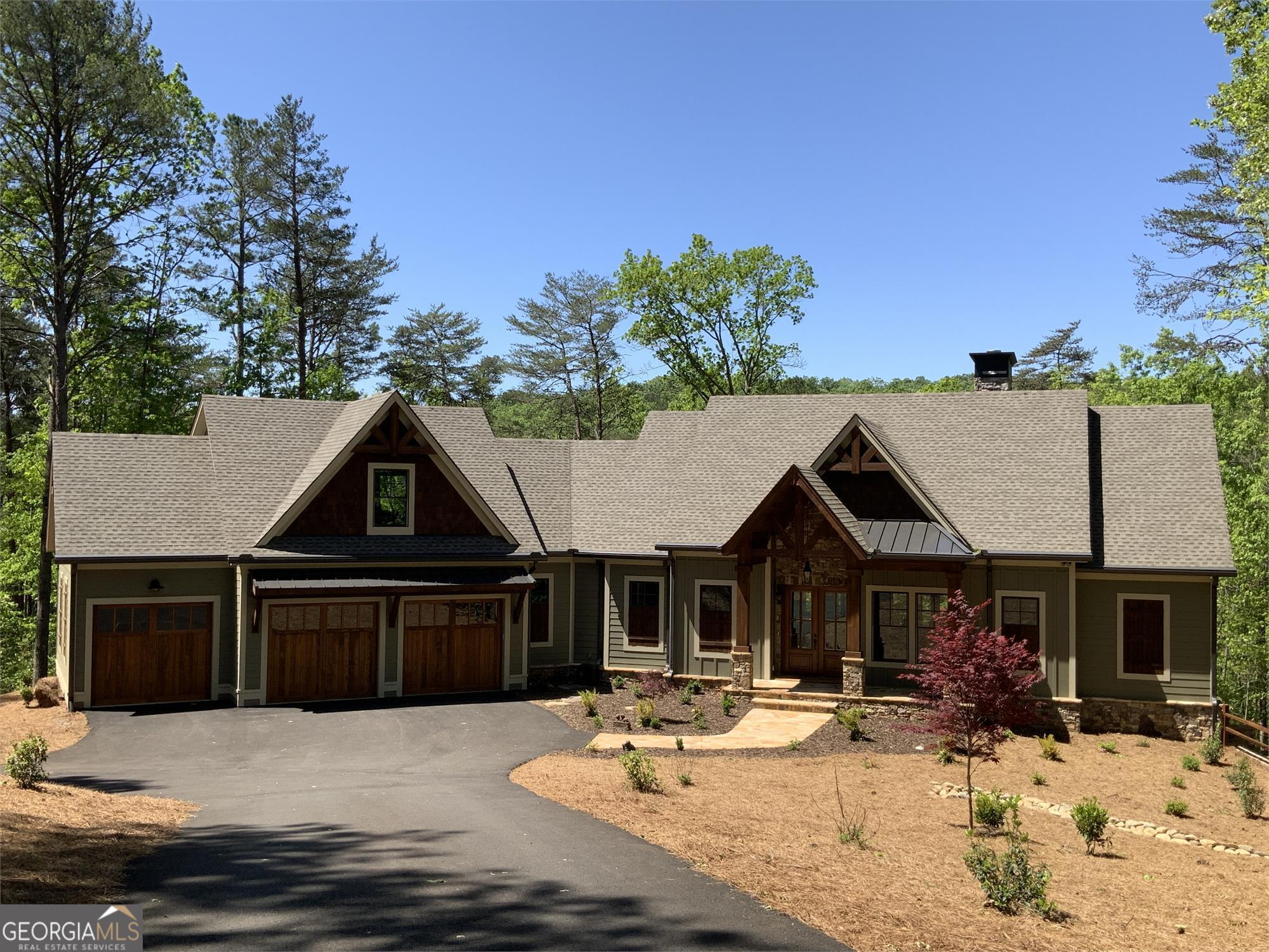 22398 Still Spring, Unit LOT 4870 Marble Hill, GA 30148 - Photo 9 of 9 a front view of a house with a yard outdoor seating and garage