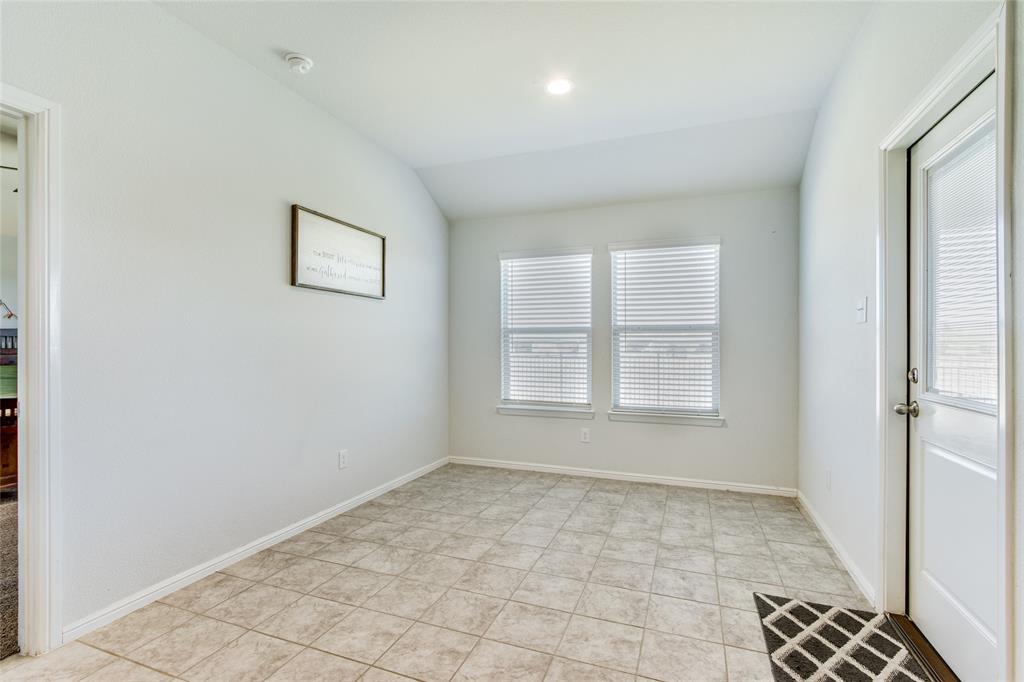 16516 Portage Street Justin, TX 76247 - Photo 14 of 29 an empty room with a empty space and windows