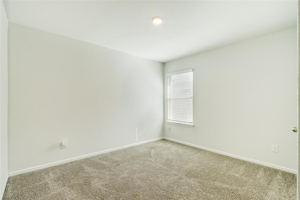 16516 Portage Street Justin, TX 76247 - Photo 20 of 29 an empty room with a window