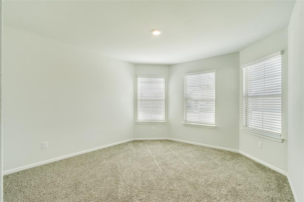 16516 Portage Street Justin, TX 76247 - Photo 21 of 29 an empty room with a window
