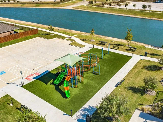 a view of a swimming pool with a yard