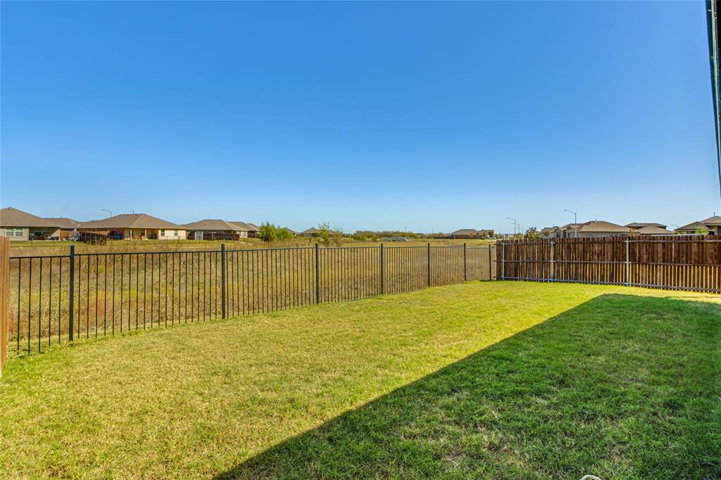 16516 Portage Street Justin, TX 76247 - Photo 4 of 29 a view of a garden