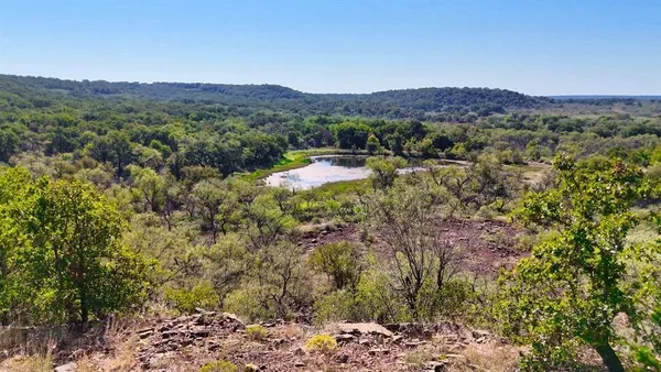 a view of a town with mountains in the background