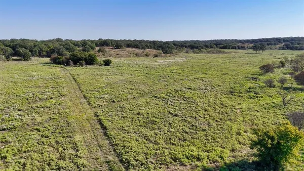 a view of a lake with a yard