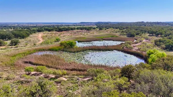 a view of a lake with mountains in the background