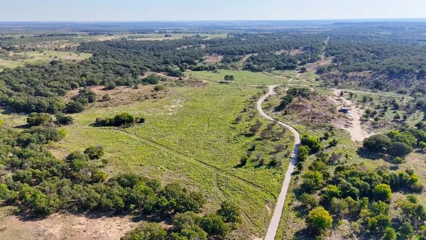 a view of a city with mountains in the background