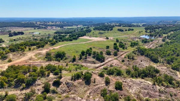 an aerial view of a residential houses and city view