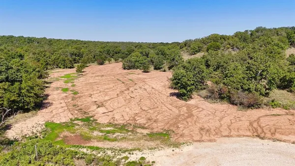 a view of a snow covered with snow in back