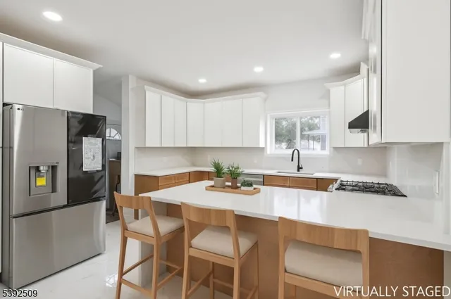 a kitchen with a dining table and chairs