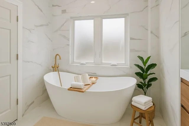 a white bath tub sitting in a bathroom