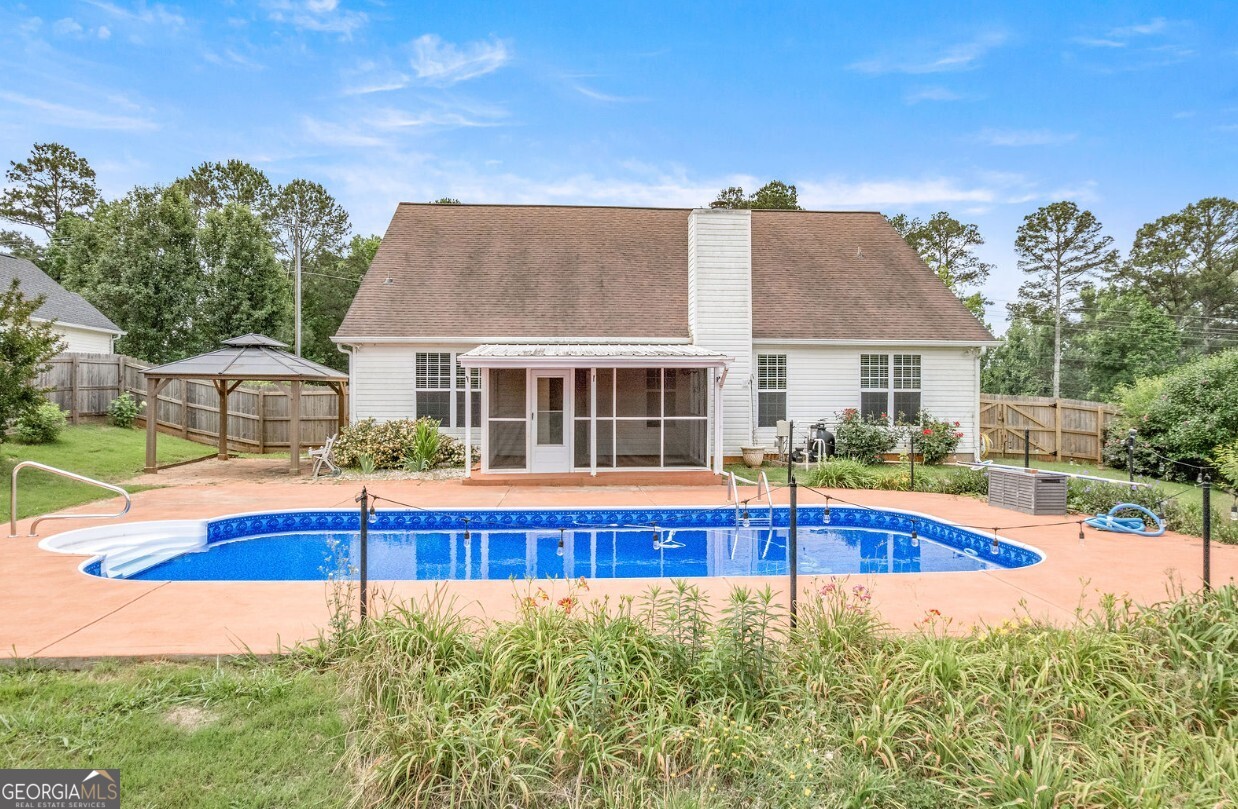 82 Newton Road LaGrange, GA 30240 - Photo 39 of 45 a view of an house with swimming pool and yard