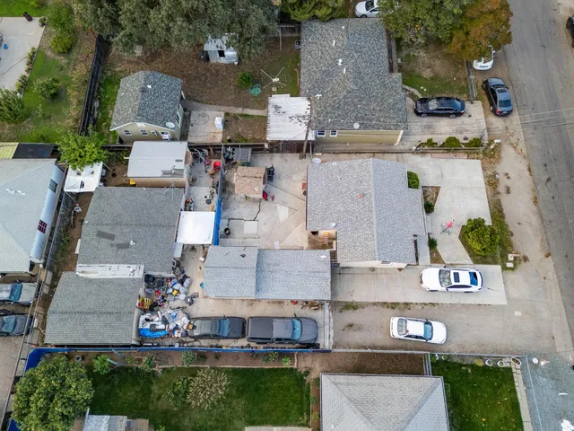 an aerial view of multiple houses with outdoor space