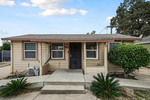 a front view of a house with a porch