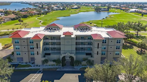 a view of swimming pool with a garden and deck