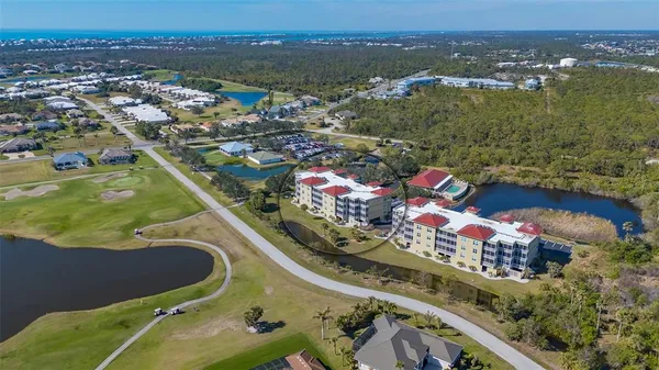a balcony with chairs and with potted plants