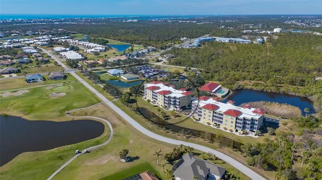 a balcony with chairs and with potted plants