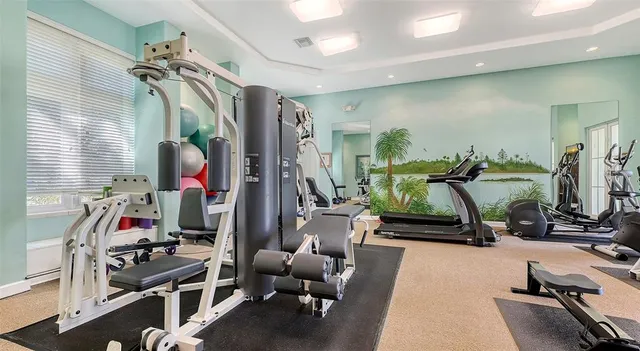 a view of a patio with a table and chairs