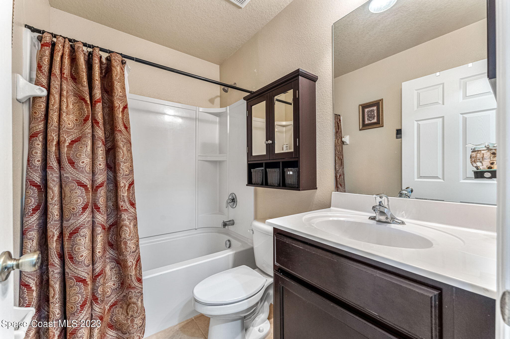 3310 Titanic Circle Indialantic, FL 32903 - Photo 13 of 25 a bathroom with a sink toilet and shower