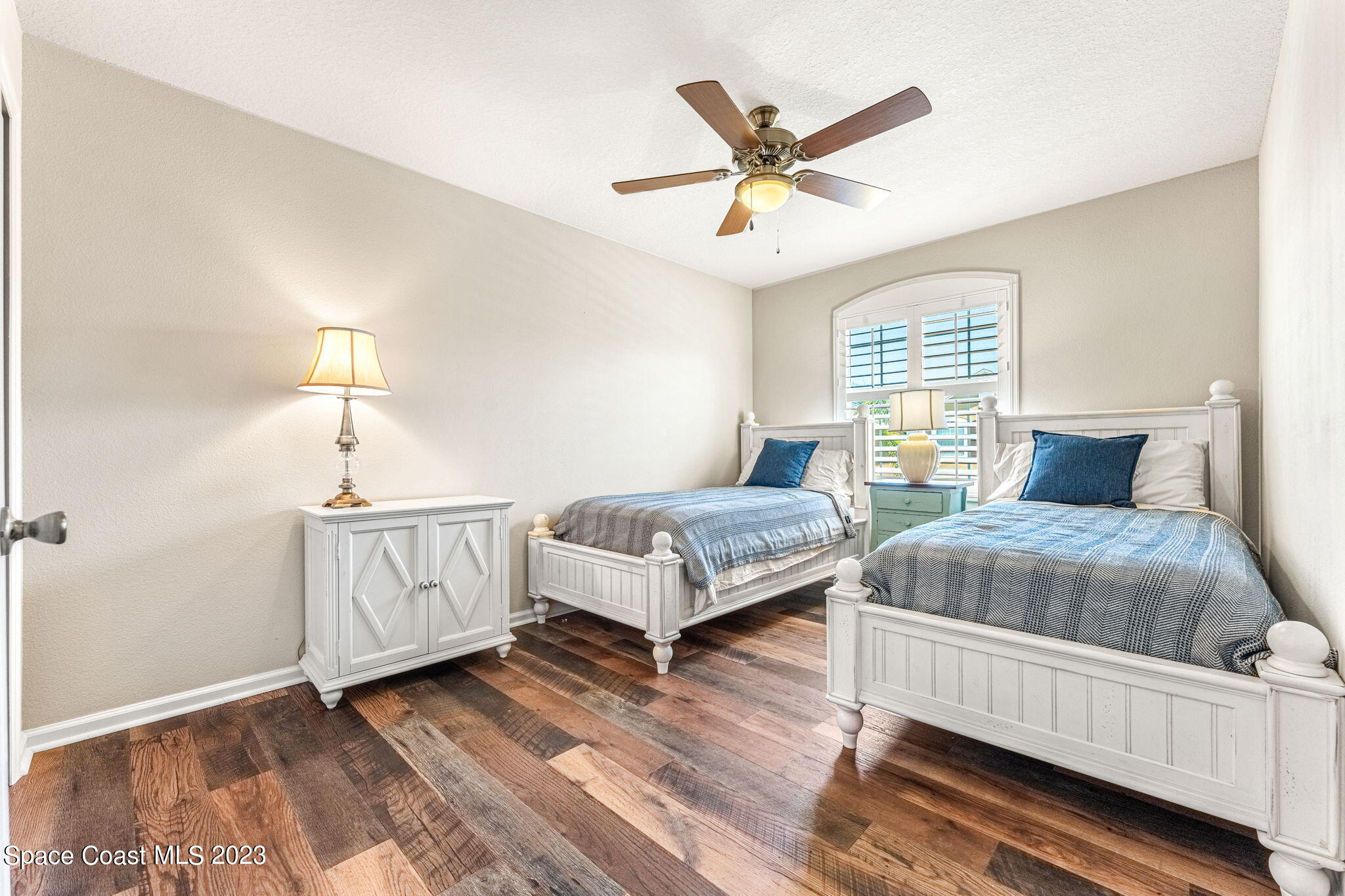 3310 Titanic Circle Indialantic, FL 32903 - Photo 14 of 25 a bedroom with a bed and window