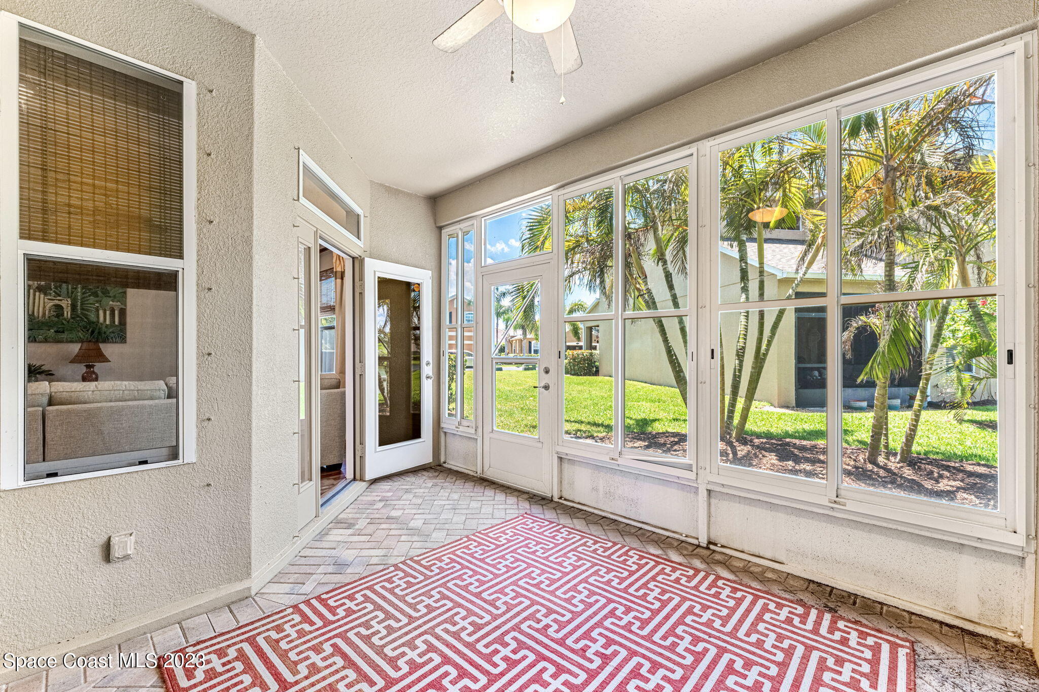 3310 Titanic Circle Indialantic, FL 32903 - Photo 15 of 25 a view of a room with wooden floor and windows