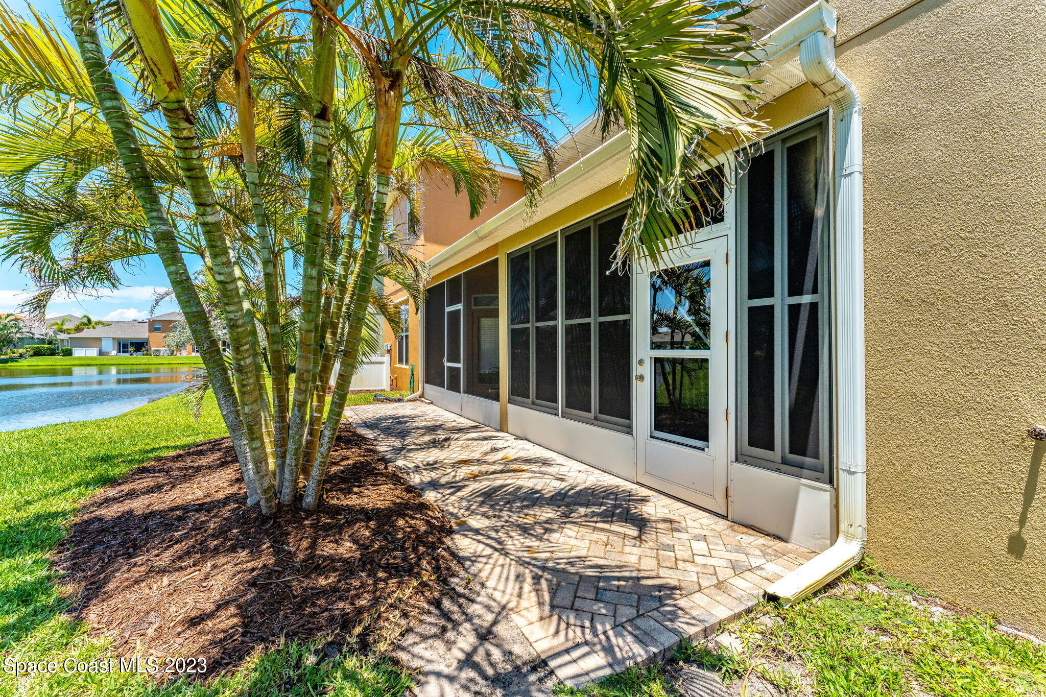 3310 Titanic Circle Indialantic, FL 32903 - Photo 17 of 25 a view of a backyard with a large tree