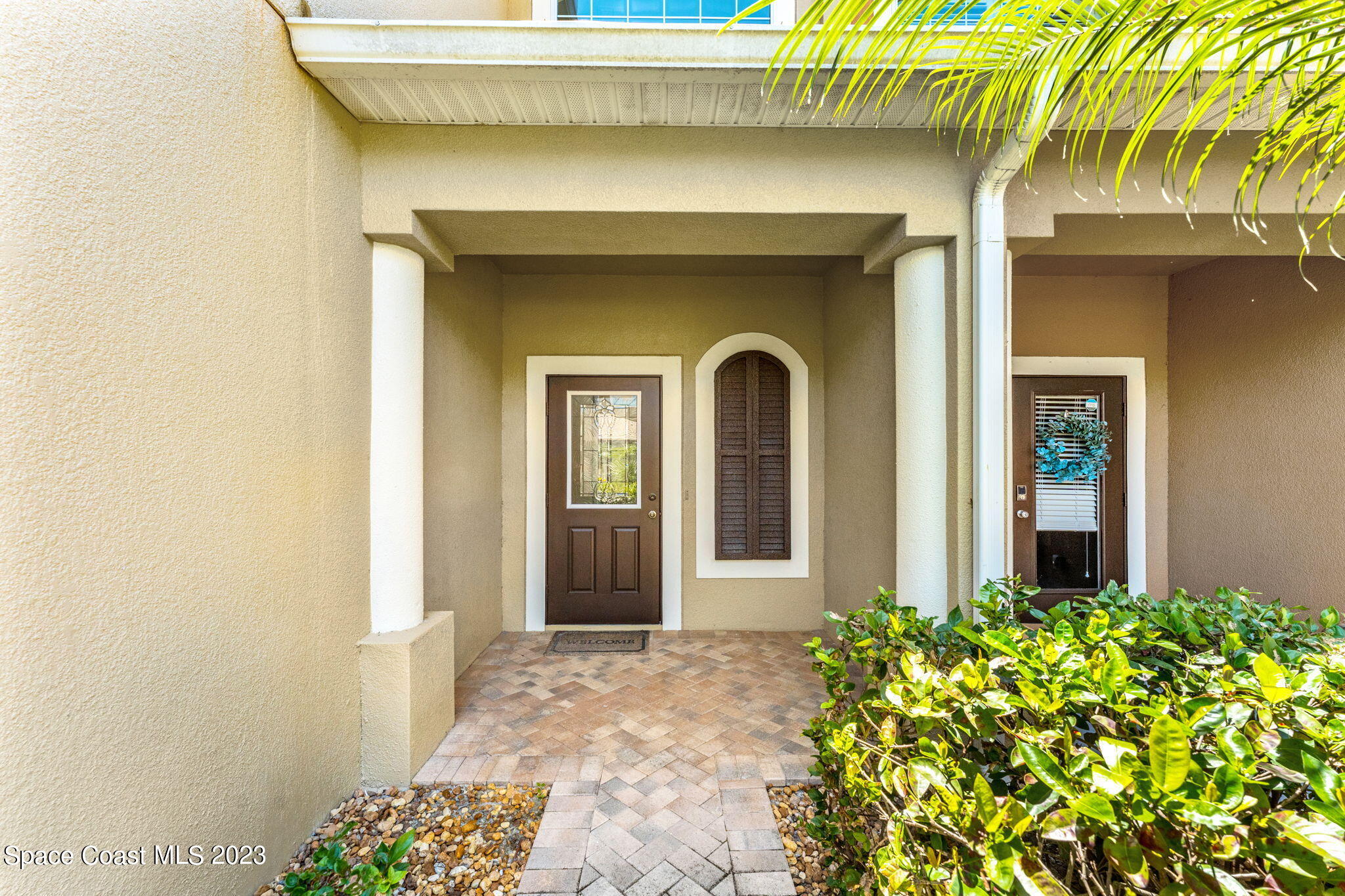 3310 Titanic Circle Indialantic, FL 32903 - Photo 2 of 25 a front view of a house with garden