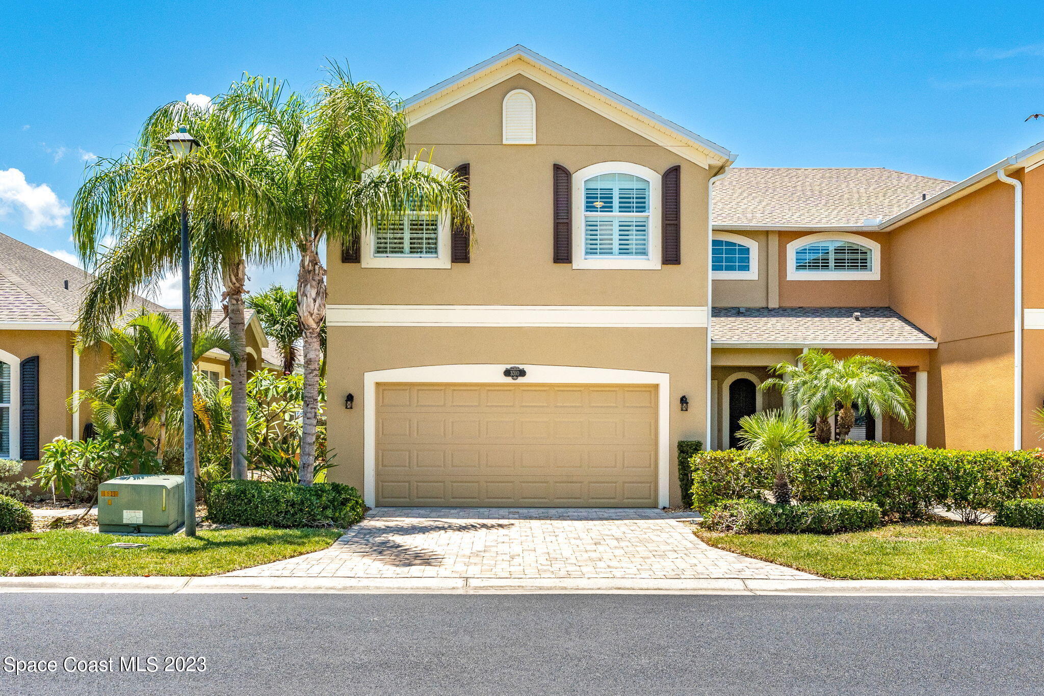 3310 Titanic Circle Indialantic, FL 32903 - Photo 24 of 25 a front view of a house with yard and garage