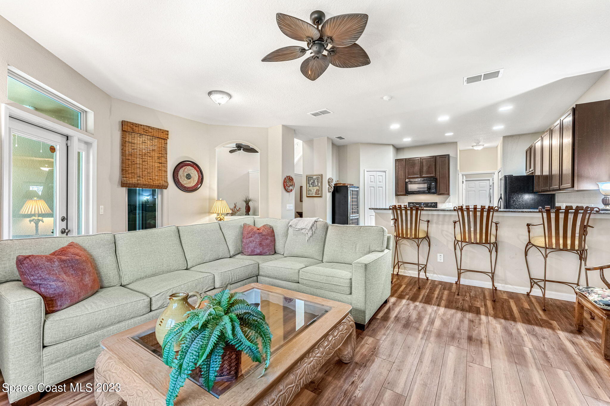 3310 Titanic Circle Indialantic, FL 32903 - Photo 4 of 25 a living room with furniture and kitchen view