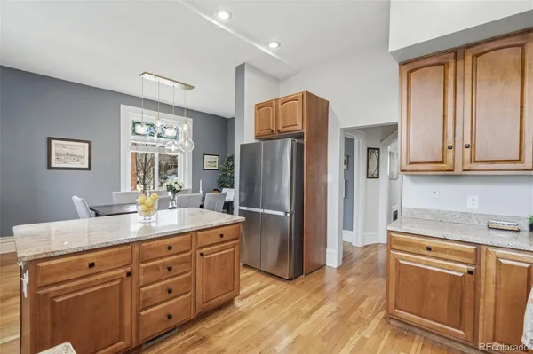 a view of a kitchen counter space and wooden floor
